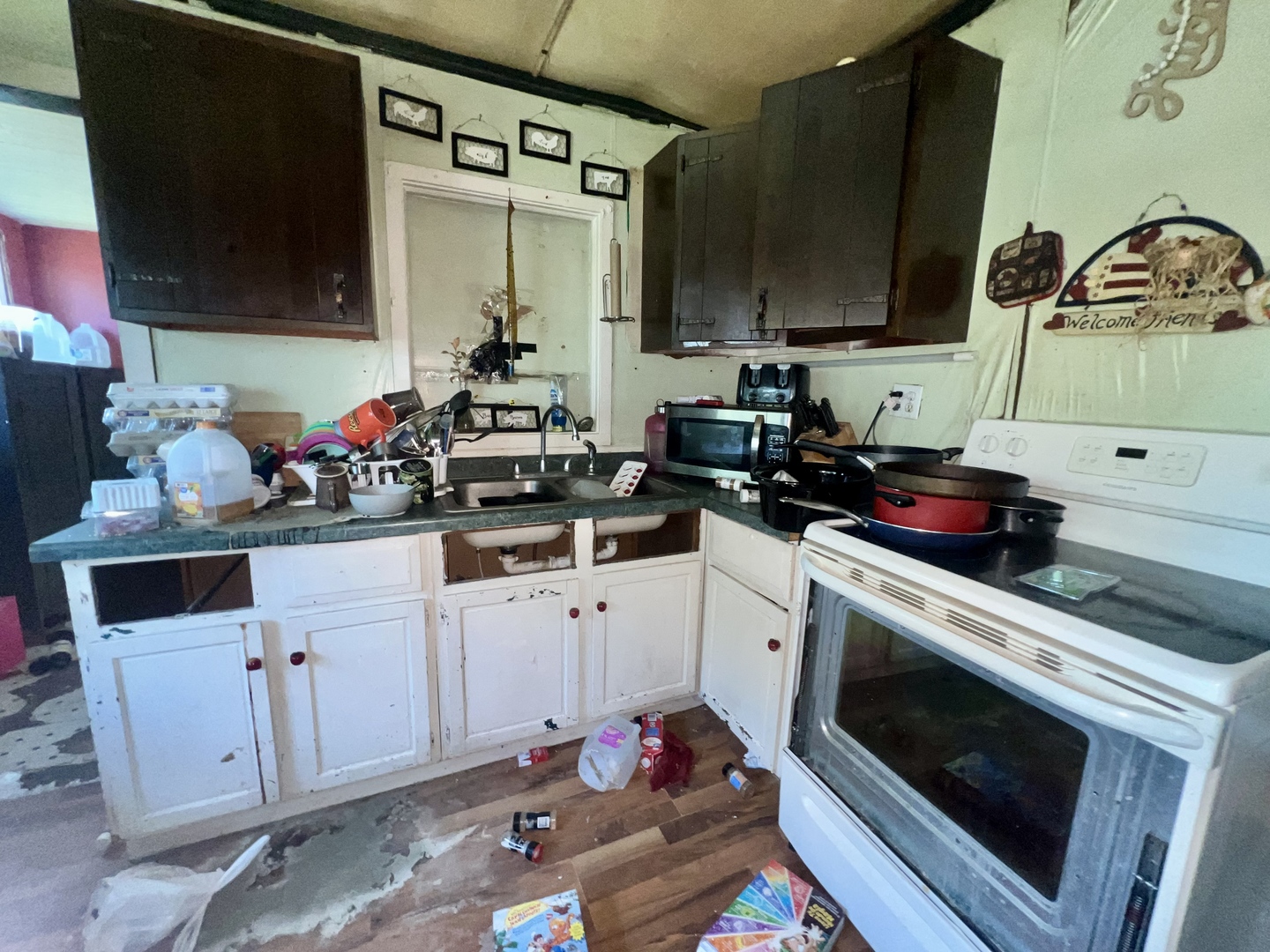 13174 Harrold Point Road Wapella, IL 61777 - Photo 11 of 23 a kitchen with a sink stove and cabinets
