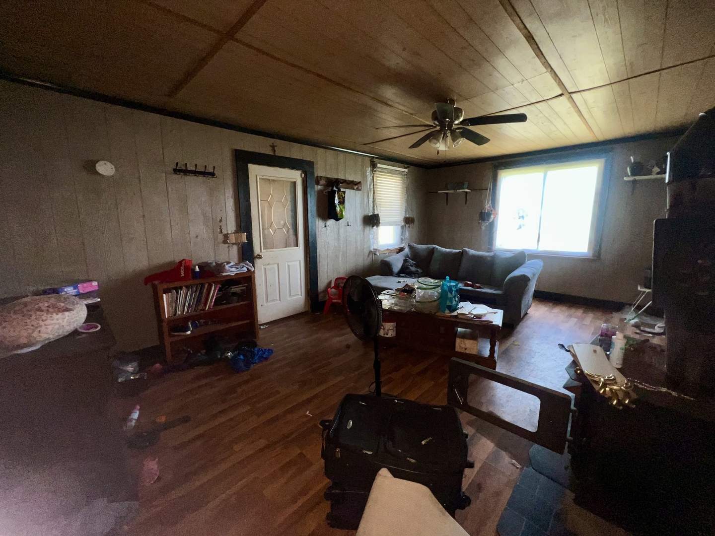 13174 Harrold Point Road Wapella, IL 61777 - Photo 7 of 23 a living room with furniture a ceiling fan and a window