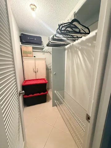 a bedroom with a bed and a shower