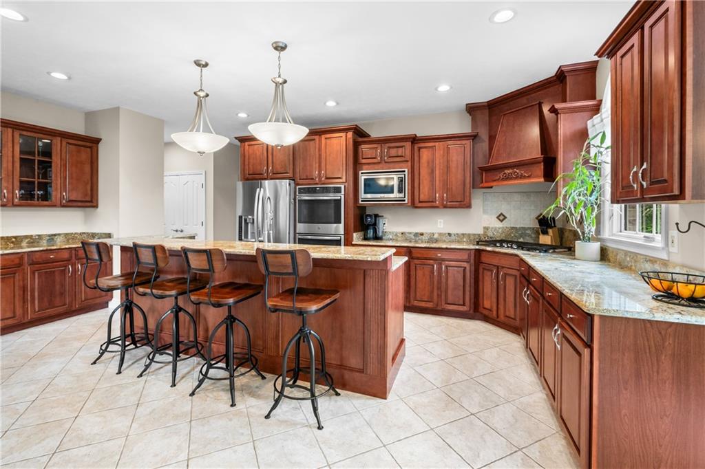 110 Marcur Lane Monaca, PA 15061 - Photo 13 of 50 a large kitchen with cabinets table and chairs