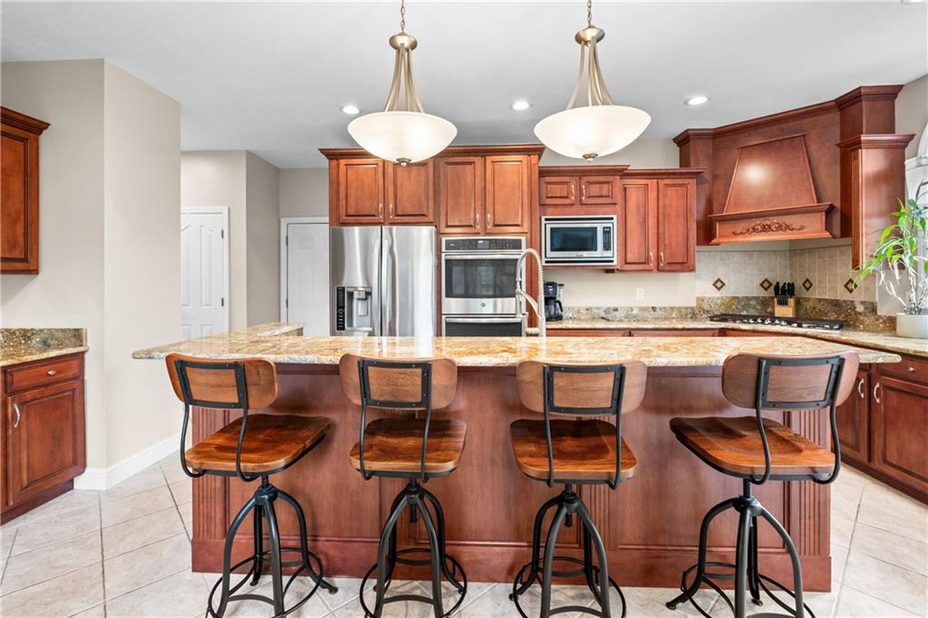 110 Marcur Lane Monaca, PA 15061 - Photo 16 of 50 a kitchen with cabinets a counter space dining table and a sink