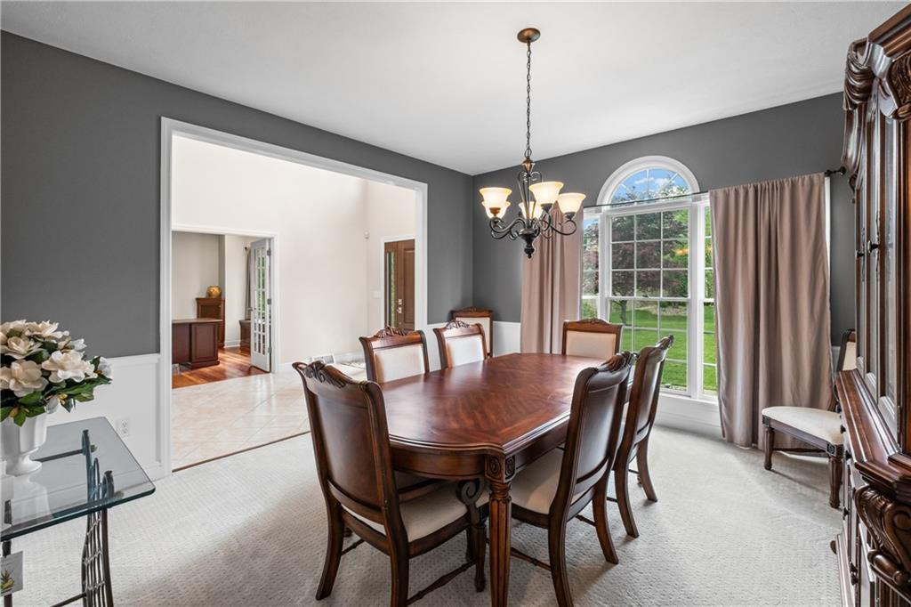 110 Marcur Lane Monaca, PA 15061 - Photo 20 of 50 a dining room with furniture a chandelier and wooden floor