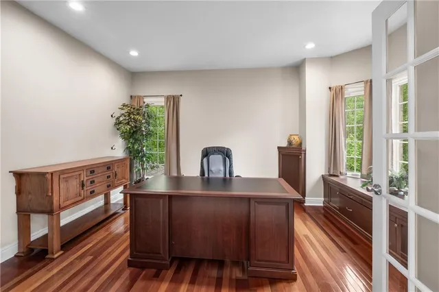 a view of kitchen with sink and refrigerator