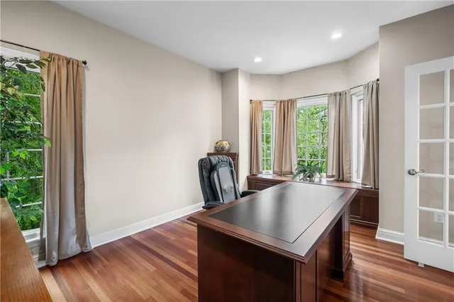 a view of a dining room with furniture and wooden floor