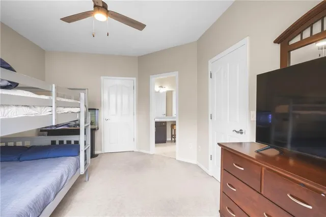 a living room with stainless steel appliances kitchen island granite countertop furniture and a kitchen view