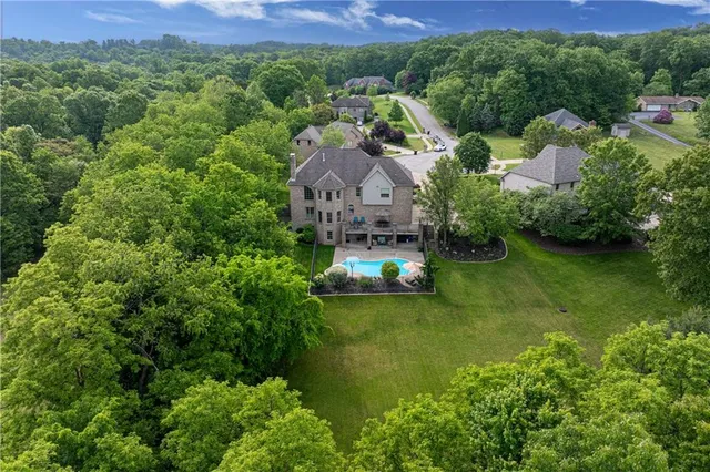 a aerial view of a house with a yard