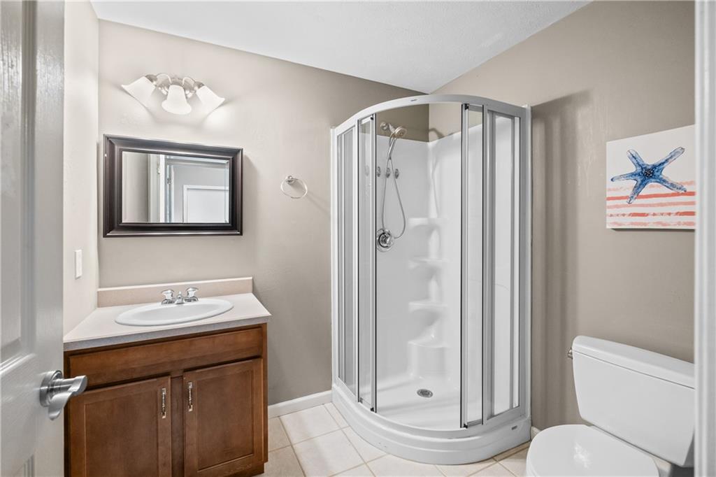 110 Marcur Lane Monaca, PA 15061 - Photo 43 of 50 a bathroom with a sink a toilet a mirror and a shower