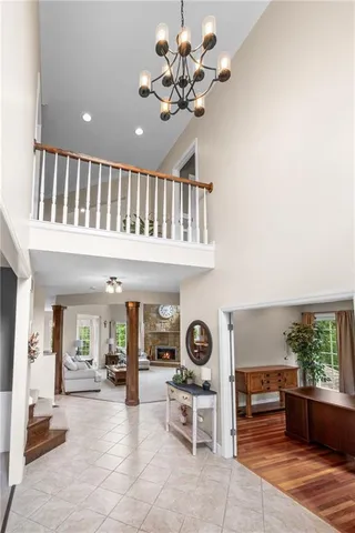 a living room with furniture and a clock