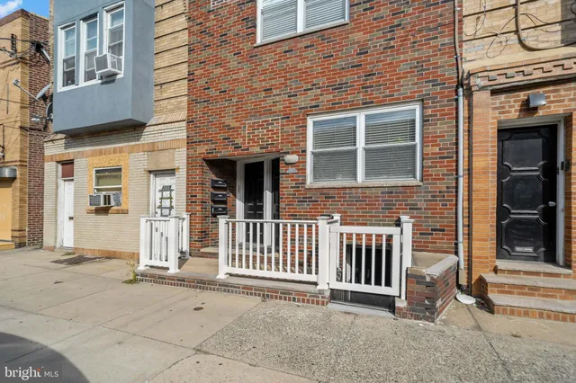 a front view of a house with a porch
