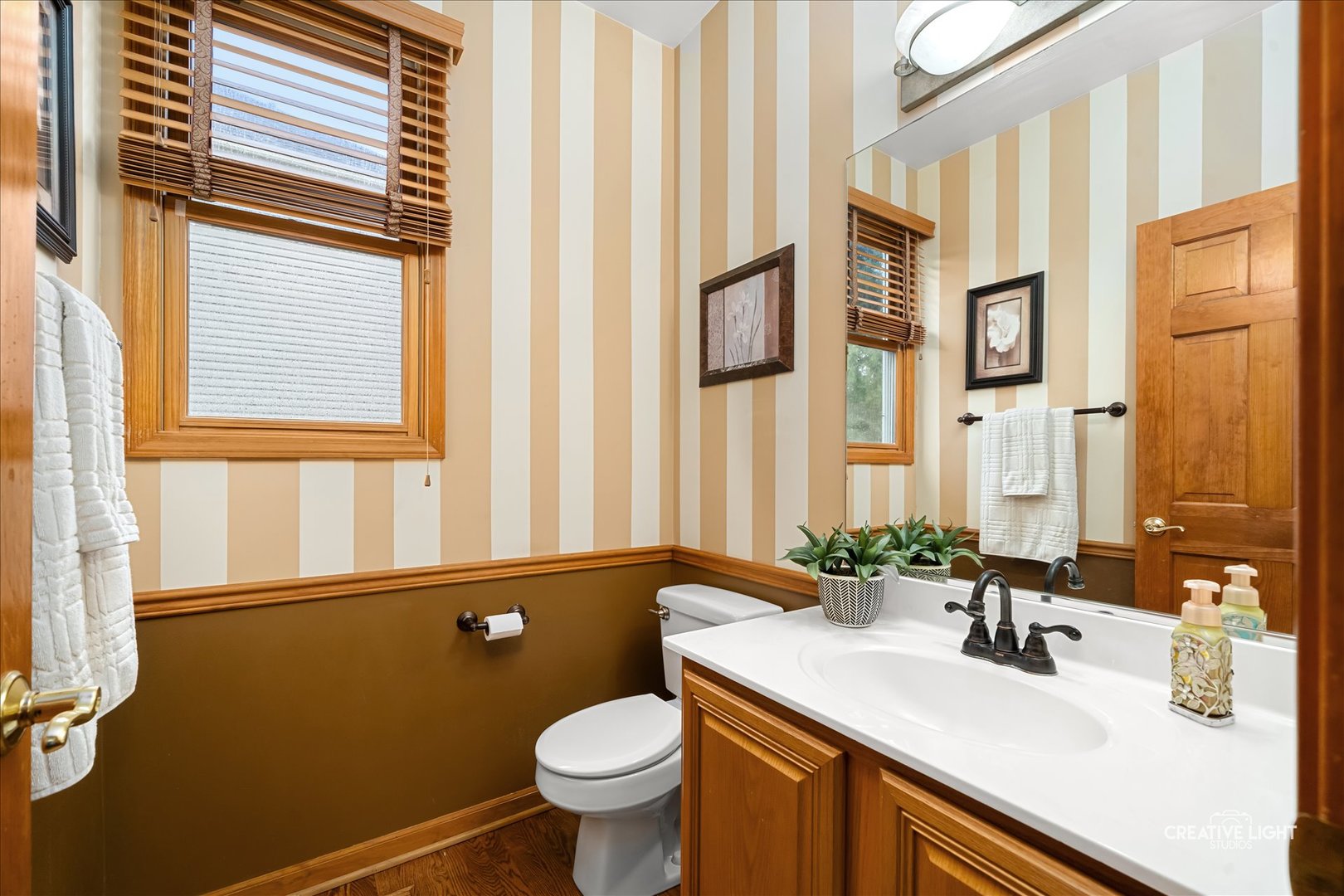 201 Violet Lane Batavia, IL 60510 - Photo 11 of 47 a bathroom with a sink a toilet and a mirror