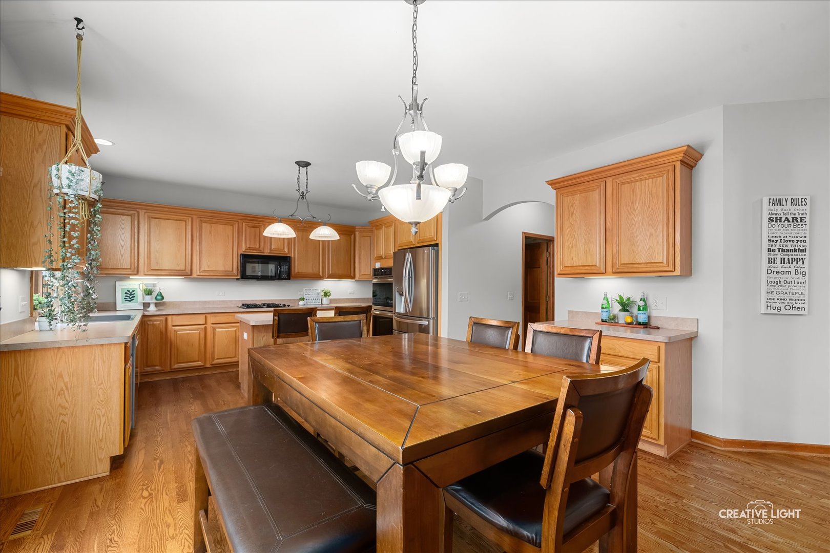201 Violet Lane Batavia, IL 60510 - Photo 17 of 47 a large kitchen with a table and chairs