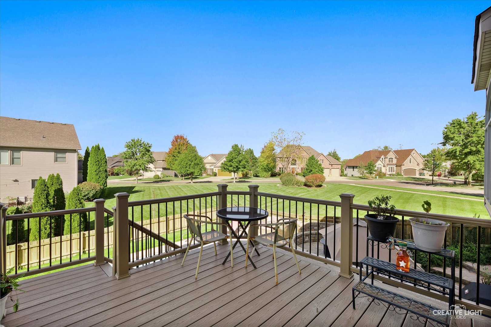 201 Violet Lane Batavia, IL 60510 - Photo 7 of 47 a view of a balcony with lake view and wooden floor