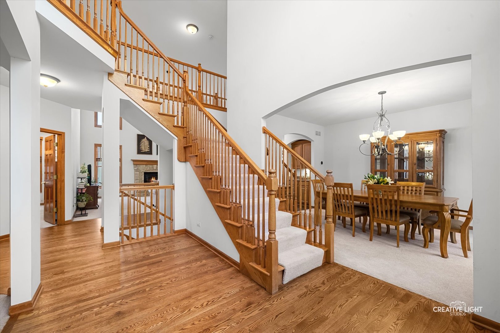 201 Violet Lane Batavia, IL 60510 - Photo 9 of 47 a view of a hallway with wooden floor and staircase