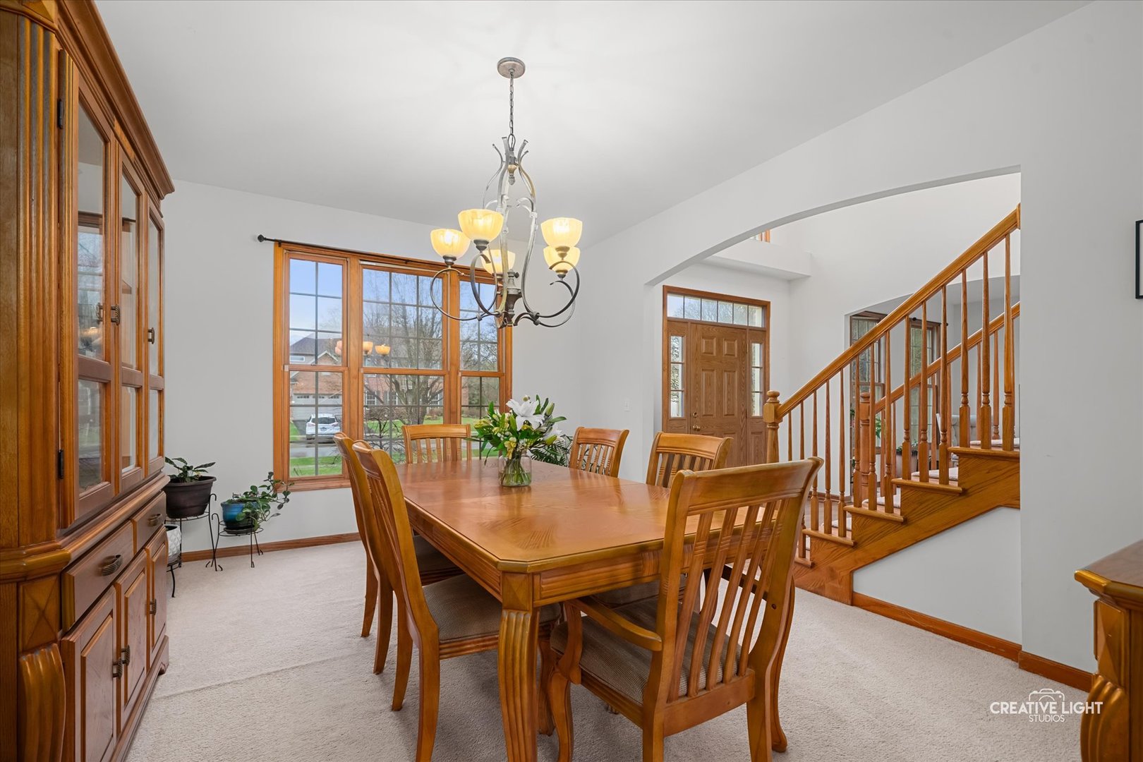 201 Violet Lane Batavia, IL 60510 - Photo 10 of 47 a view of a dining room with furniture window and wooden floor