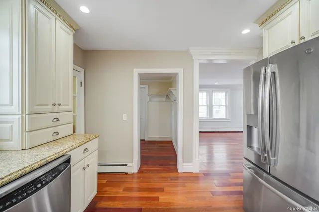 a view of a kitchen cabinets and wooden floor