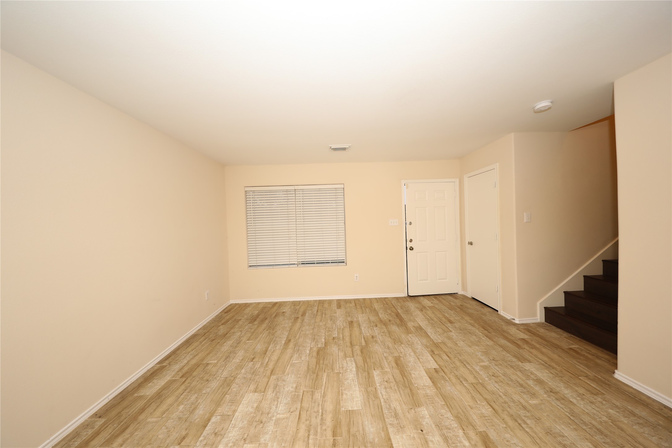 12620 Rio Bravo Street Rosharon, TX 77583 - Photo 4 of 25 a view of a room with wooden floor and white walls