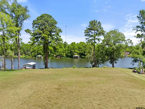a view of a lake with a building in the background