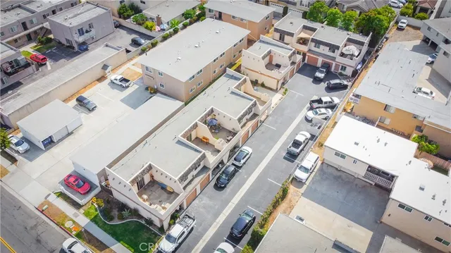 an aerial view of a residential building with an outdoor space