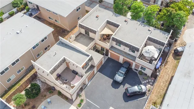 an aerial view of a house with backyard
