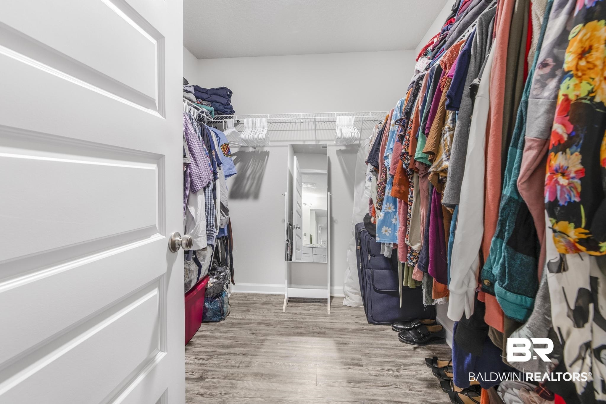 10738 Ridgeview Drive Mobile, AL 36608 - Photo 28 of 48 Walk in closet with light wood-style flooring