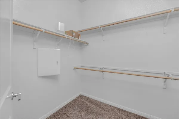 a view of a room with racks on the wall