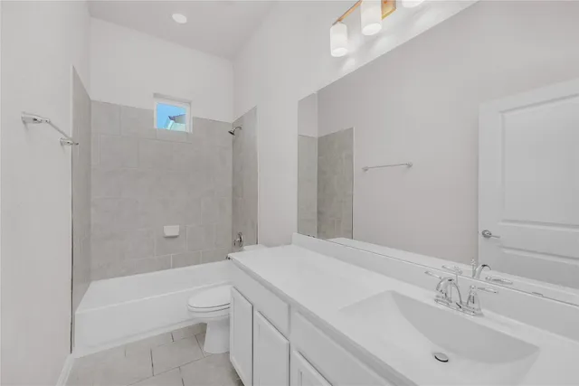 a bathroom with a bathtub shower sink and toilet