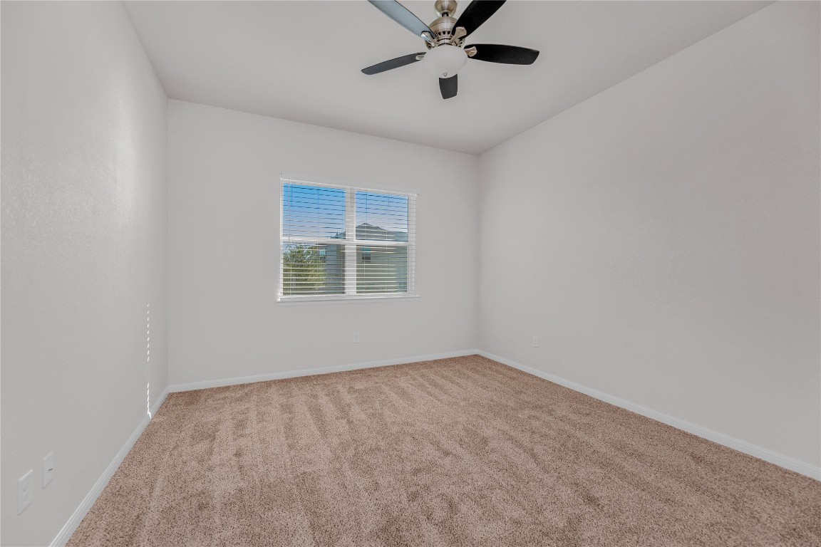 9941 Comely Bend Manor, TX 78653 - Photo 19 of 31 a view of an empty room with a window