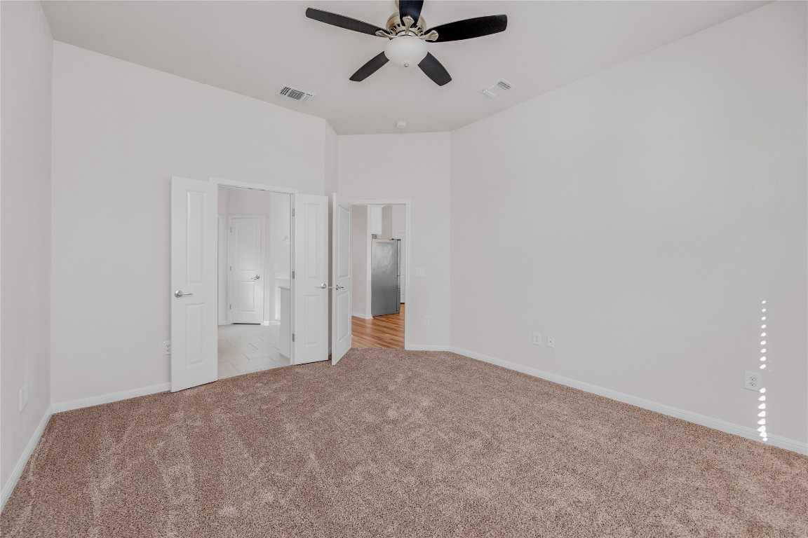 9941 Comely Bend Manor, TX 78653 - Photo 20 of 31 a view of empty room with ceiling fan
