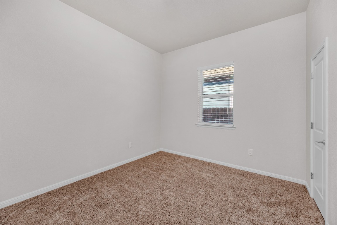 9941 Comely Bend Manor, TX 78653 - Photo 22 of 31 an empty room with a window