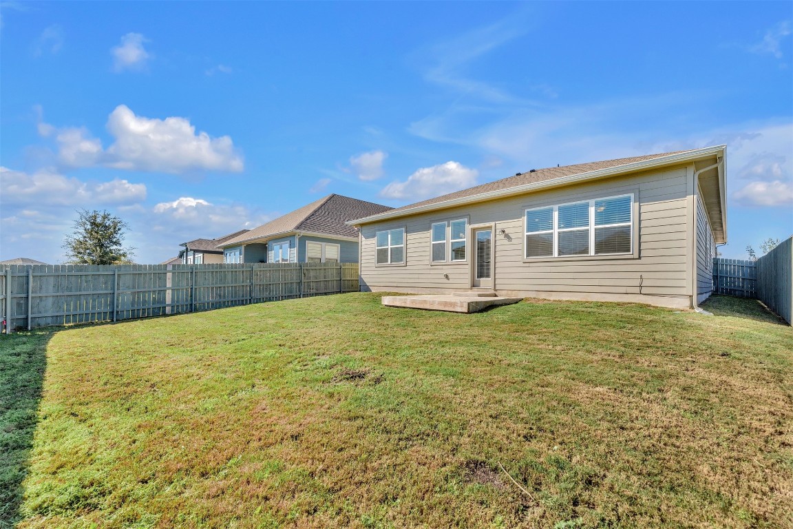 9941 Comely Bend Manor, TX 78653 - Photo 29 of 31 a view of a house with backyard and sitting area