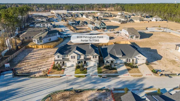 a view of a hallway with a wooden door