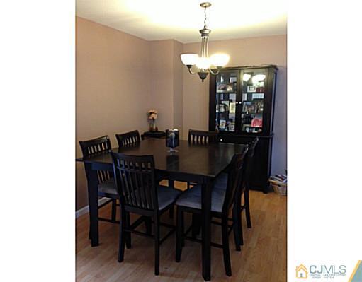 1806 Ridgeview Court Sayreville, NJ 08859 - Photo 2 of 7 a view of a dining room with a table and chairs