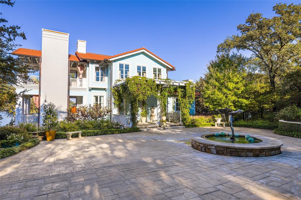 a view of a house with entertaining space and a fire pit