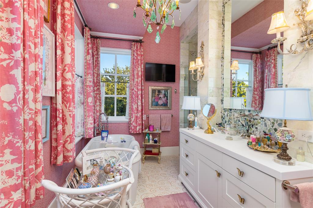 13230 Miller Road Azle, TX 76020 - Photo 11 of 37 a spacious bathroom with a sink mirror and a bathtub
