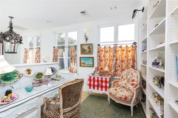 a bedroom with furniture and a window