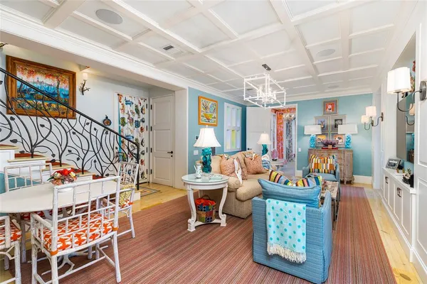 a bedroom with a bed a flat screen tv and a fireplace