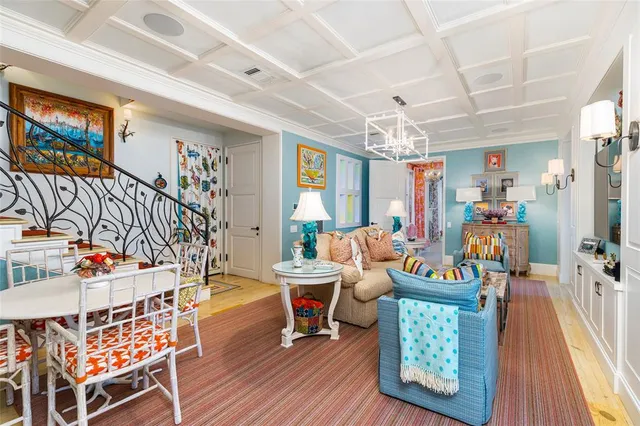 a bedroom with a bed a flat screen tv and a fireplace