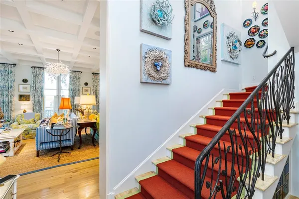 a view of entryway and hall with wooden floor