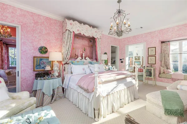 a bed room with a bed and a chandelier