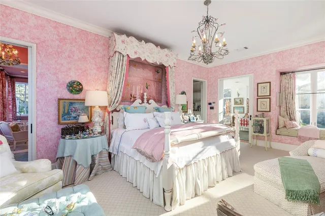 a bed room with a bed and a chandelier