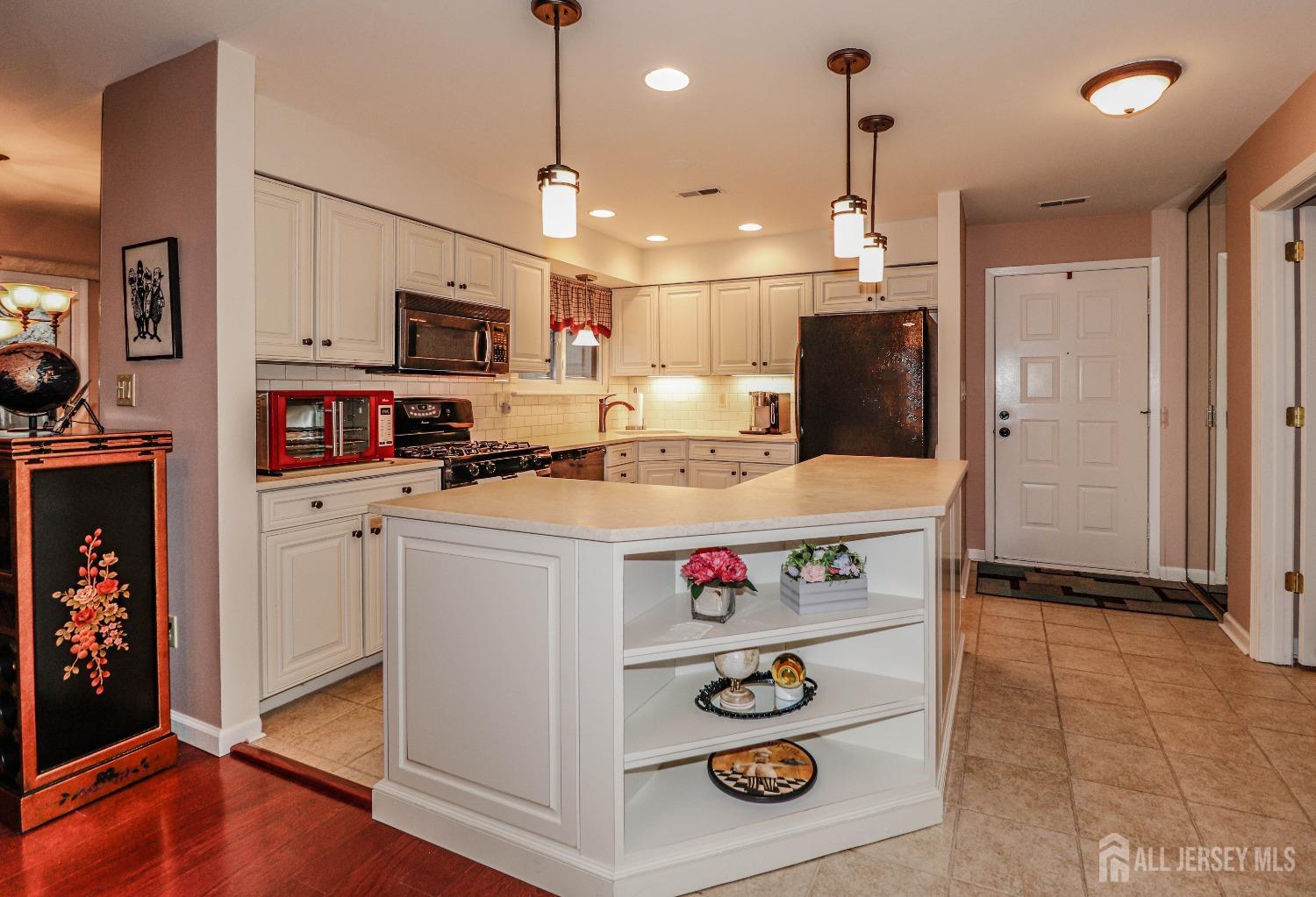34 Park Gate Drive Edison, NJ 08820 - Photo 12 of 31 a kitchen with stainless steel appliances granite countertop a sink a refrigerator and a stove