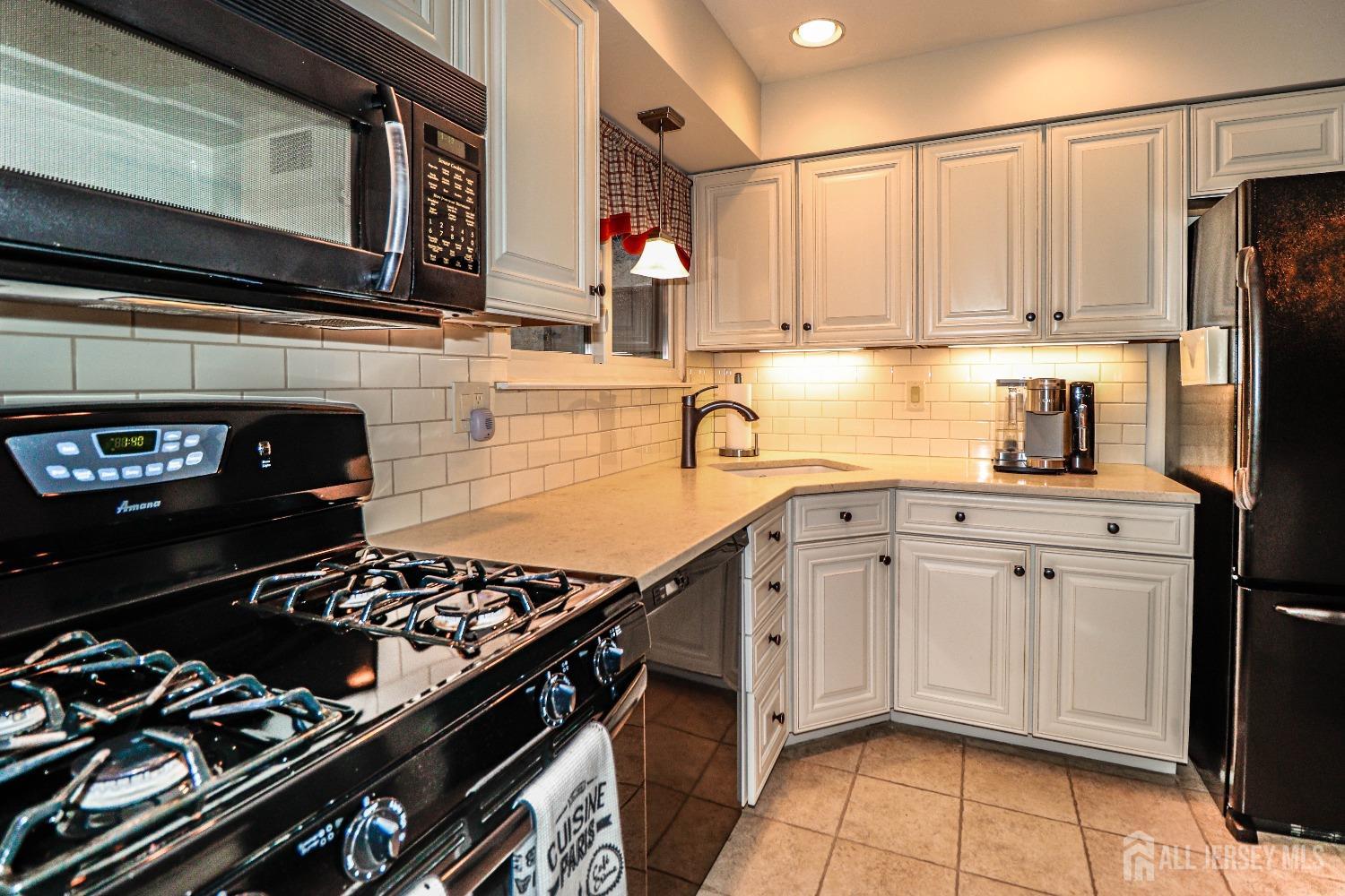 34 Park Gate Drive Edison, NJ 08820 - Photo 13 of 31 a kitchen with stainless steel appliances granite countertop a stove and a refrigerator