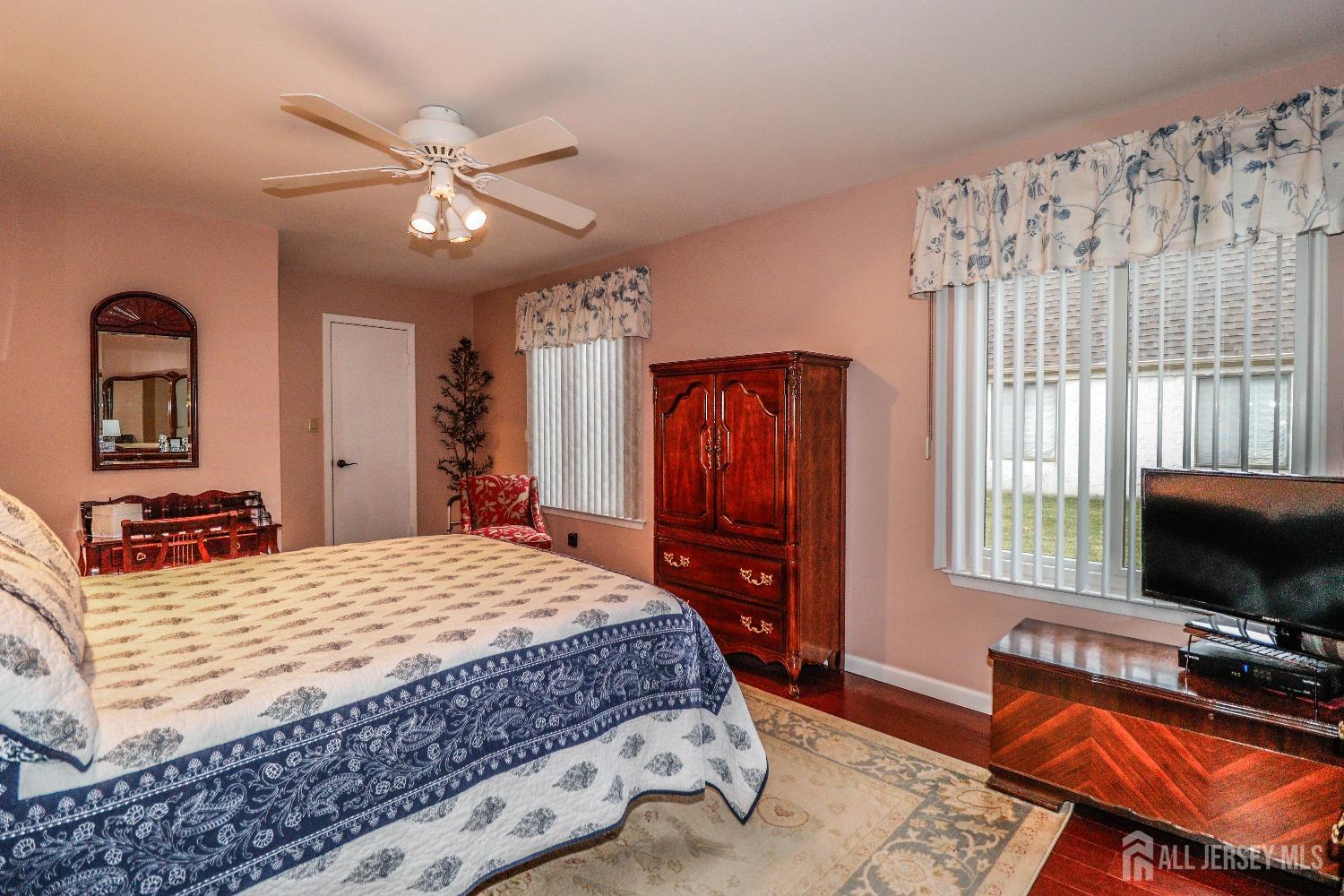 34 Park Gate Drive Edison, NJ 08820 - Photo 25 of 31 a bedroom with a bed and a flat screen tv
