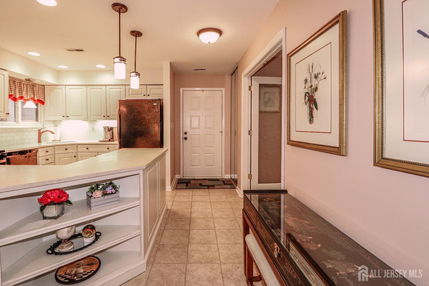 34 Park Gate Drive Edison, NJ 08820 - Photo 6 of 31 a kitchen with kitchen island a stove a sink and a refrigerator