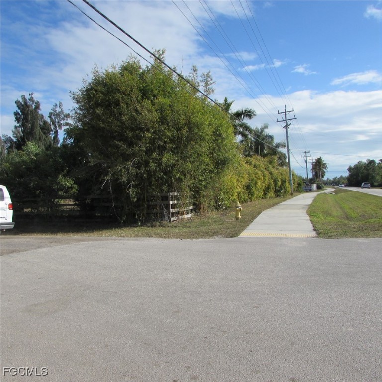 8390 Stringfellow Road St. James City, FL 33956 - Photo 19 of 25 a view of a street with a yard