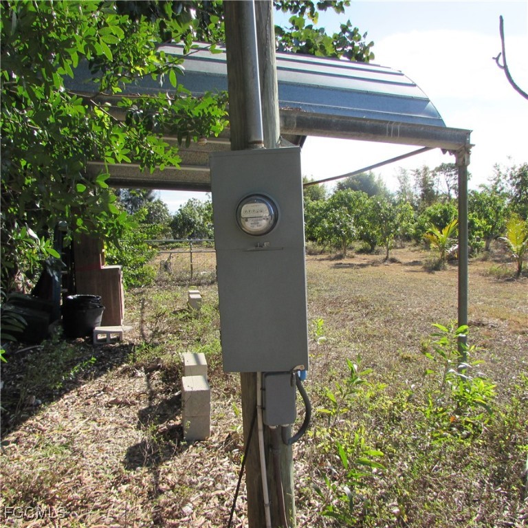 8390 Stringfellow Road St. James City, FL 33956 - Photo 2 of 25 a front view of a house with garden