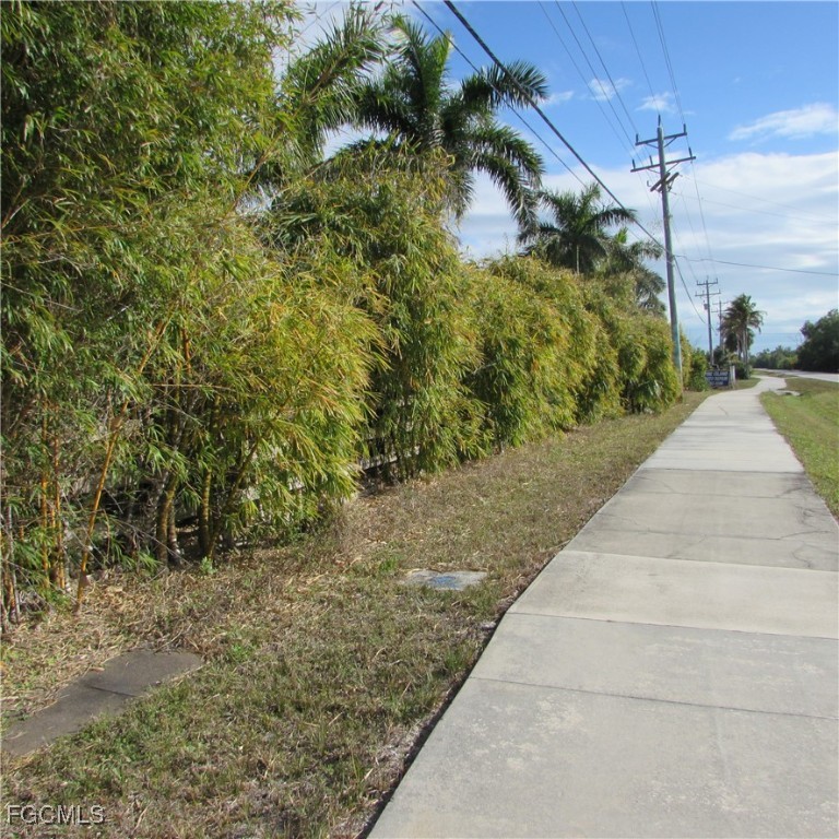 8390 Stringfellow Road St. James City, FL 33956 - Photo 21 of 25 a view of path and green space
