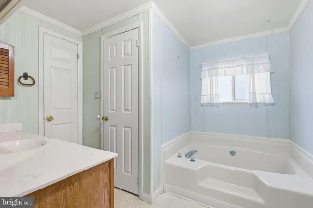 a bathroom with a bathtub and a sink