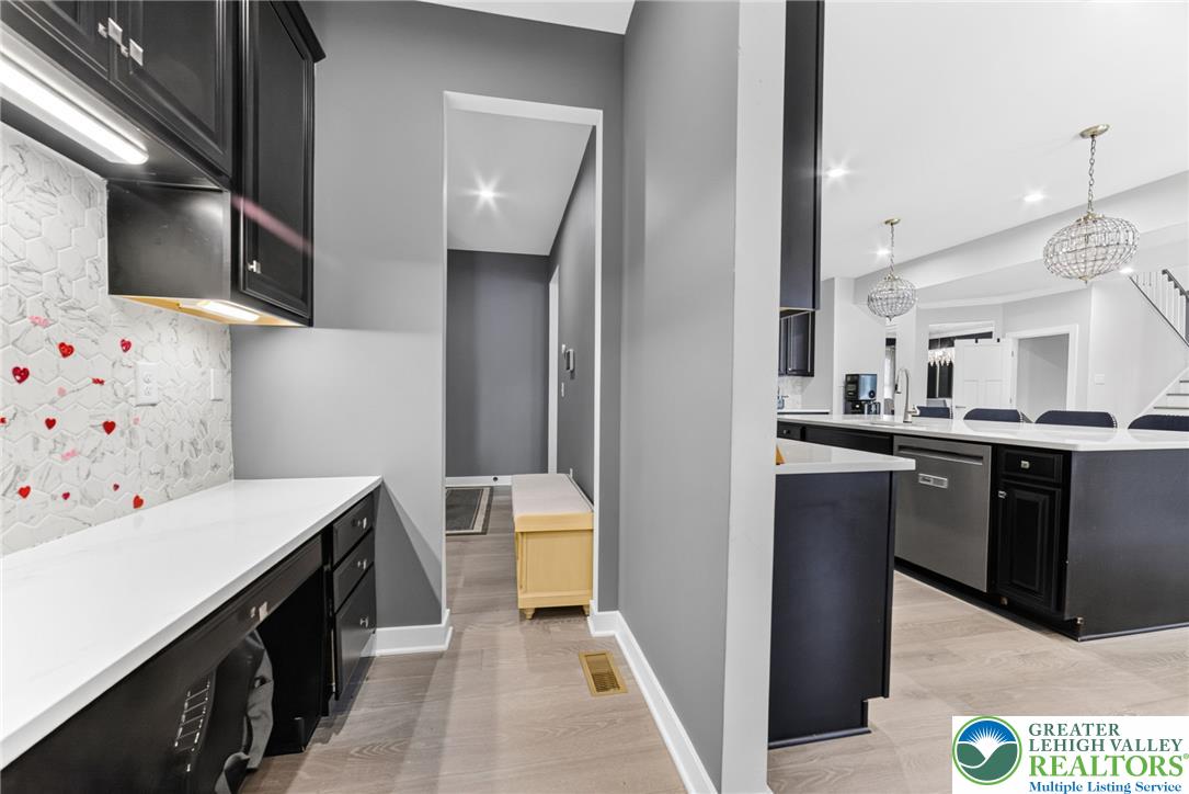 3952 Orth Street Bethlehem, PA 18020 - Photo 15 of 60 Streamlined work-from-home area paired with a sophisticated kitchen, ready for both productivity and culinary adventures.