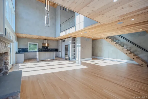 a view of a hall with wooden floor